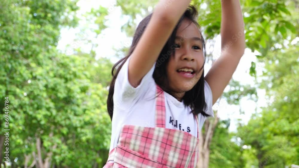 Child enjoying the hanging rope bridge in the park. Child enjoying the hanging rope bridge in the park.