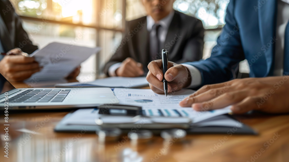Lawyer explaining financial documents to a couple during a meeting Lawyer explaining financial documents to a couple during a meeting