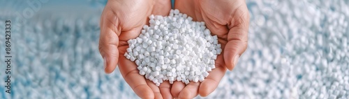 A handful of white plastic pellets.