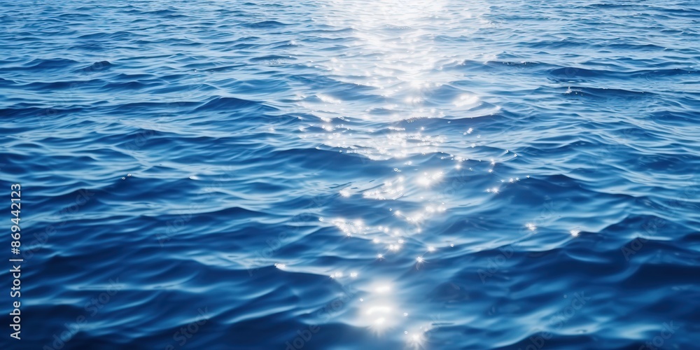 Naklejka premium Sparkling Ocean Water, sparkling sunlight reflecting on the deep blue sea