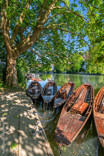Traditional punt boats (Stocherkahn) at the pier at the Neckar River in Tübingen, Germany