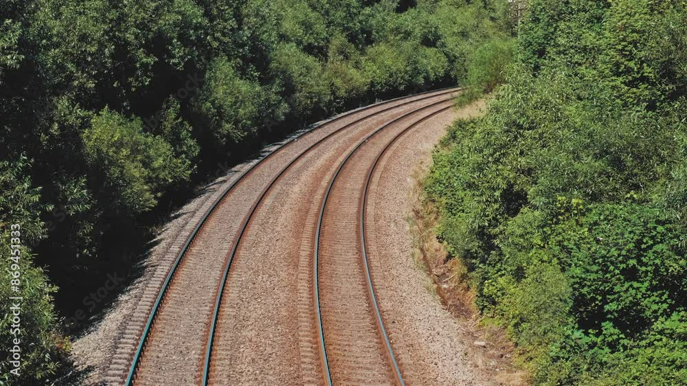 Parallel Railroad Tracks with Concrete Underlay and Crushed Stones Ballast Trackbed
