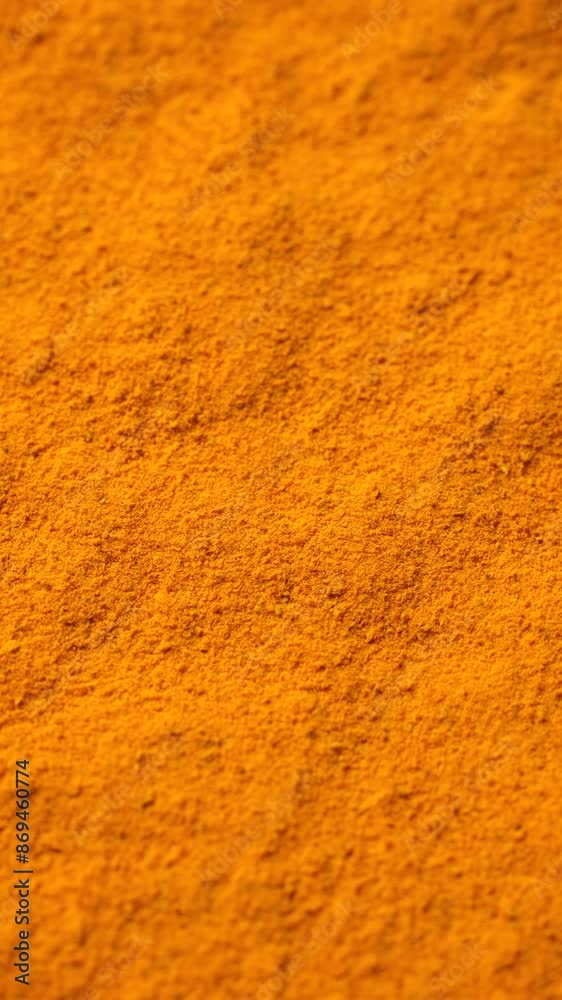 zoom frame Yellow turmeric powder top view, rotation. Condiment or dietary supplement zoom frame Yellow turmeric powder top view, rotation. Condiment or dietary supplement