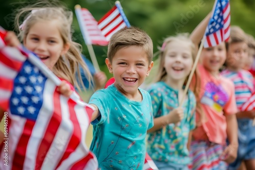 A group of cheerful children waving American flags outdoors, celebrating a patriotic event or holiday with joy and excitement.