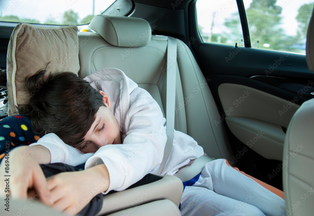 Child sleeping peacefully with seatbelt in car seat Child sleeping peacefully with seatbelt in car seat