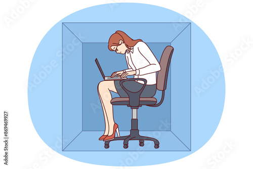 Woman with laptop sits in cardboard box typing article working in cramped office of small company. Young girl office worker is inconvenienced due to lack of free space in workplace