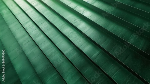 Abstract close-up of green pleated texture, creating a striking pattern and structured lines. Perfect for backgrounds, design, and creative projects.