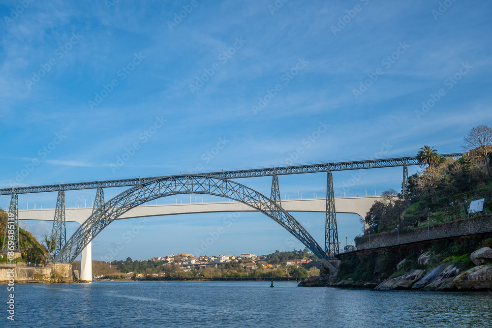 Maria Pia Bridge over Douro River Porto Portugal with the Ponte da Arrabida bridge seen in the background Maria Pia Bridge over Douro River Porto Portugal with the Ponte da Arrabida bridge seen in the background
