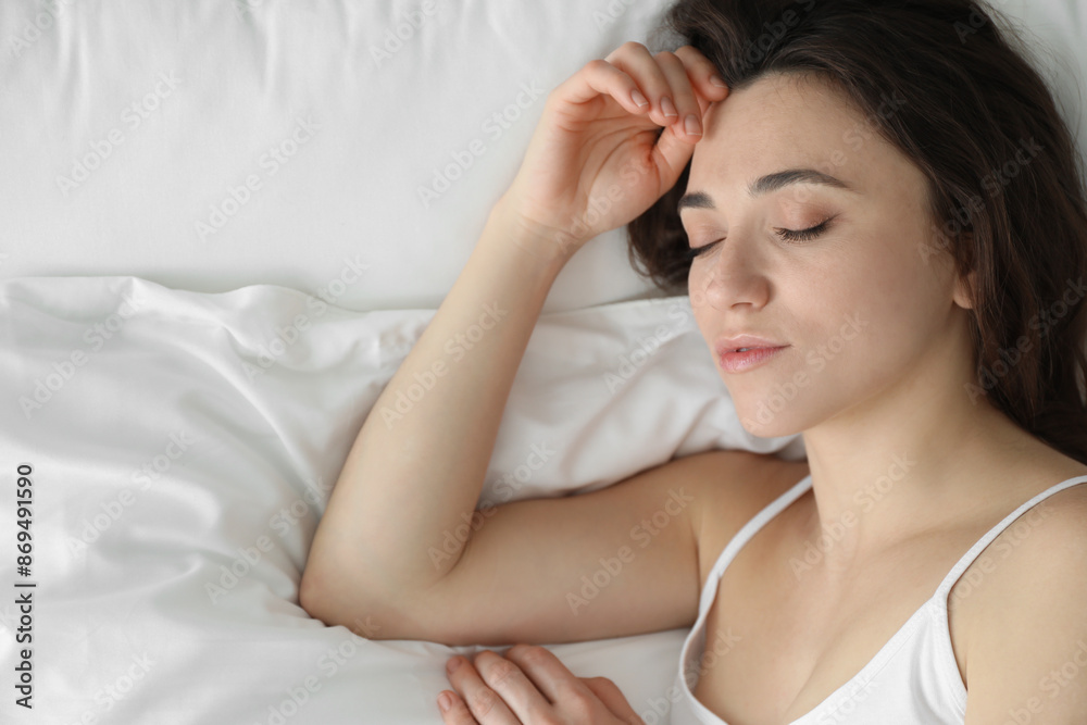 Bedtime. Beautiful woman sleeping on bed in morning, top view. Space for text Bedtime. Beautiful woman sleeping on bed in morning, top view. Space for text