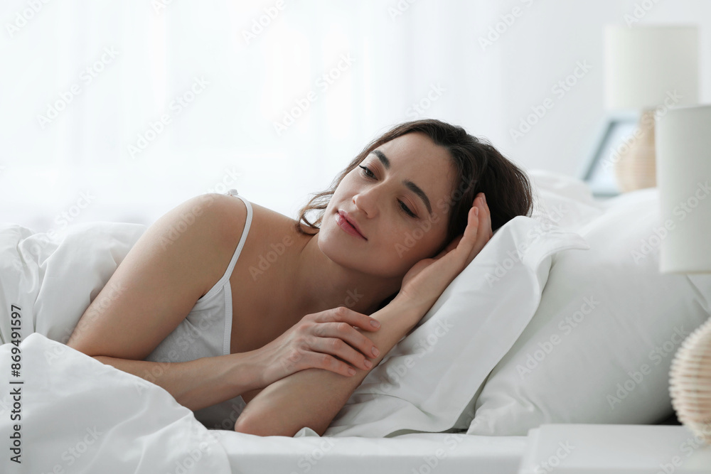 Bedtime. Beautiful woman lying in bed at home Bedtime. Beautiful woman lying in bed at home
