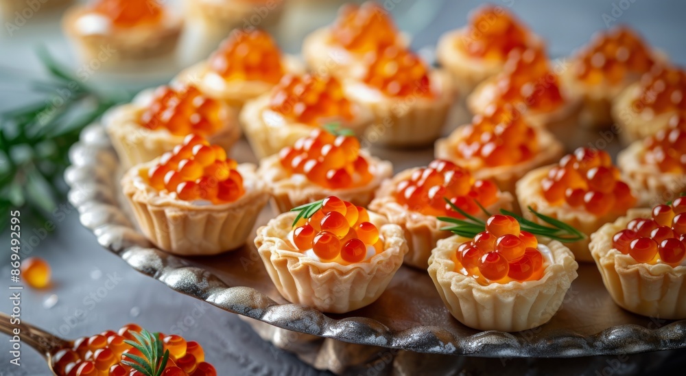 Appetizer Tarts With Red Caviar on a White Plate Appetizer Tarts With Red Caviar on a White Plate