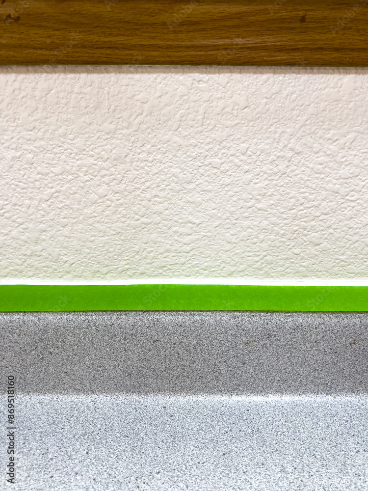 Fototapeta premium Close-Up of Masking Tape and Countertop Edge During Home Renovation