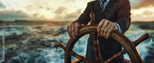Wallpaper Mural Businessman hands on ship's wheel, navigating through rough seas concept of leadership and marketing strategy business man in suit standing at the helm steering boat on blurred background Torontodigital.ca