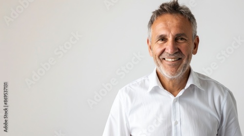 Older White Male Businessman. Portrait of Happy Smiling Entrepreneur in White Shirt, Casual Attire © Popelniushka
