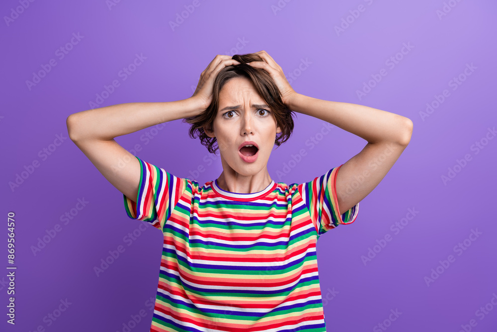 Portrait of confused speechless girl arms touch head open mouth staring isolated on purple color background Portrait of confused speechless girl arms touch head open mouth staring isolated on purple color background