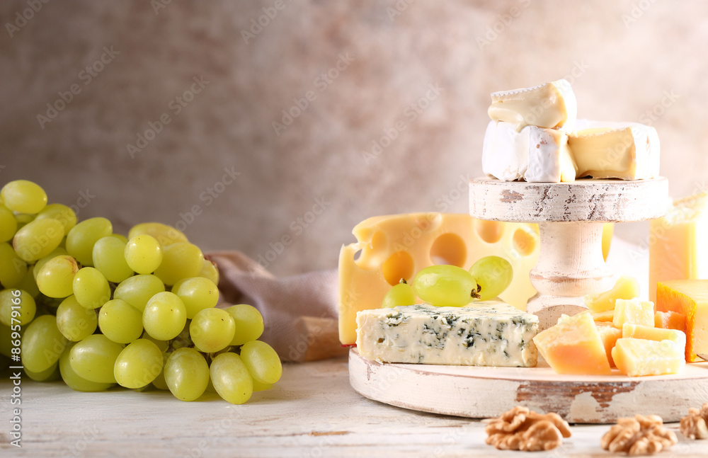 assorted hard and soft cheeses on a wooden table assorted hard and soft cheeses on a wooden table