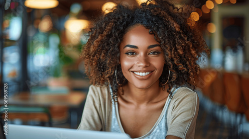 Young African American Woman Smiling While Using Laptop in Coffee Shop, Portrait Photo, Hyperrealistic Photography with Professional Color Grading
