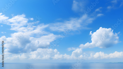 Breathtaking Display of Azure Sky Interspersed with Wispy White Clouds under Sunny Daylight © Zachary