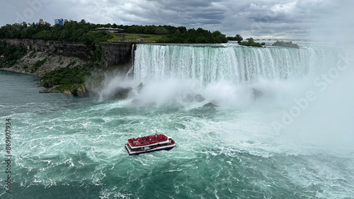 Tourist boat on Niagara Falls. Ontario, Canada. Aerial view of the Niagara Falls. 