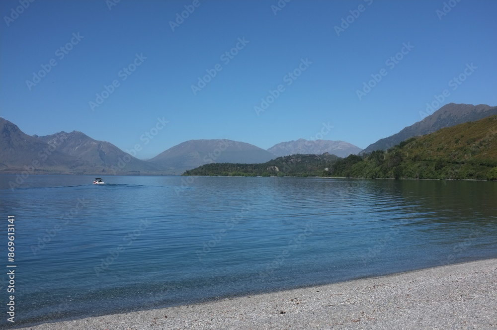Photo of lakeside view of Lake Wakatipu or Whakatipu wai-maori and The Remarkables in Glenorchy, Otago region, South Island of New Zealand. Photo of lakeside view of Lake Wakatipu or Whakatipu wai-maori and The Remarkables in Glenorchy, Otago region, South Island of New Zealand.