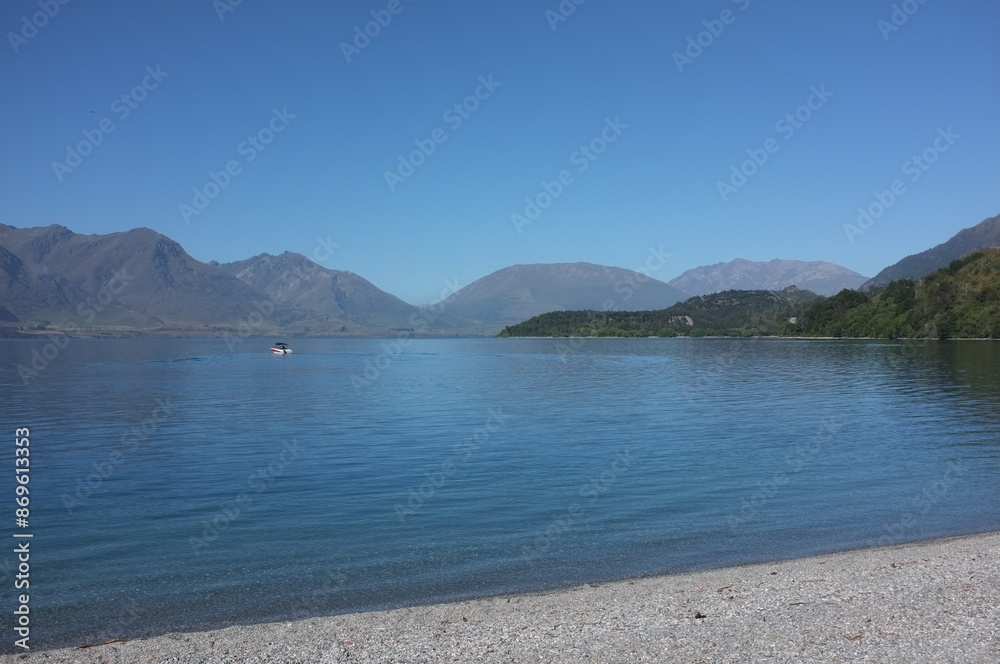 Photo of lakeside view of Lake Wakatipu or Whakatipu wai-maori and The Remarkables in Glenorchy, Otago region, South Island of New Zealand. Photo of lakeside view of Lake Wakatipu or Whakatipu wai-maori and The Remarkables in Glenorchy, Otago region, South Island of New Zealand.