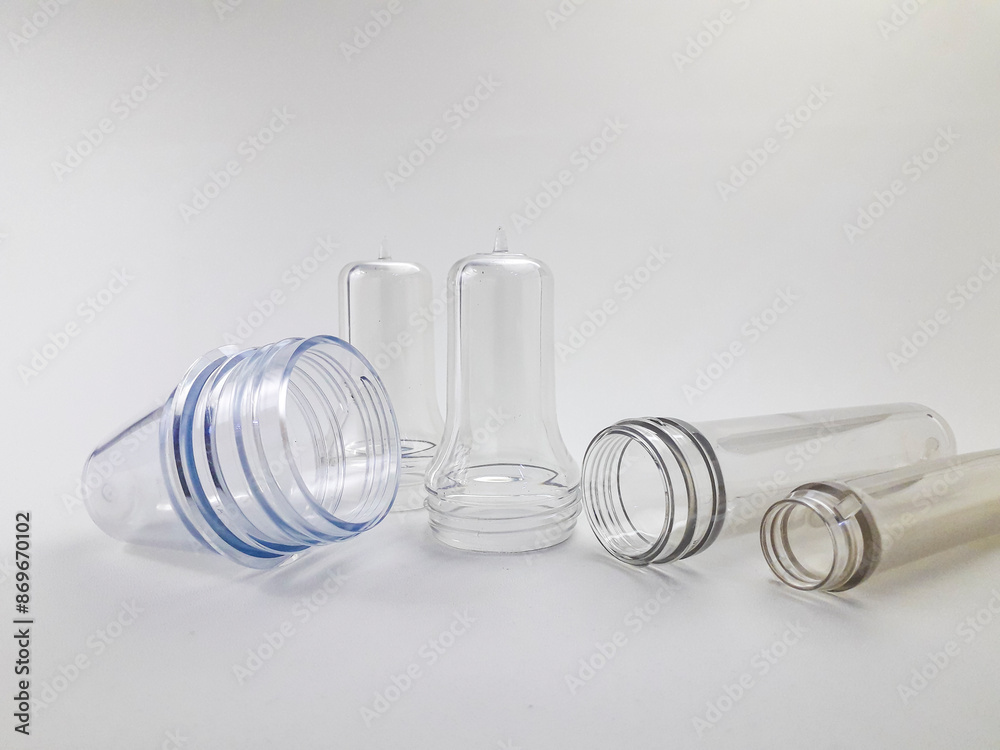 PET preform isolated on a white background, is plastic that is the result of injection before the blow molding process in making PET bottles PET preform isolated on a white background, is plastic that is the result of injection before the blow molding process in making PET bottles