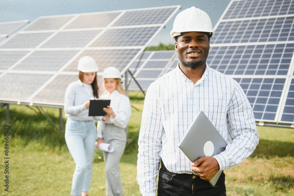 African american technician check the maintenance of the solar panels. Black man engineer at solar station