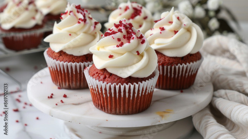 Cute and fluffy 3D red velvet cupcakes that are perfect for any celebration. © Rabil