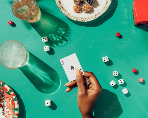 Woman holding winning card in hand at a poker table at Bright pastel green color.