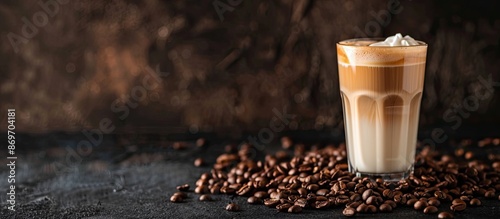 Latte macchiato and geyser coffee maker displayed with a glass of latte macchiato, scattered coffee beans on a dark background, with ample copy space image. photo