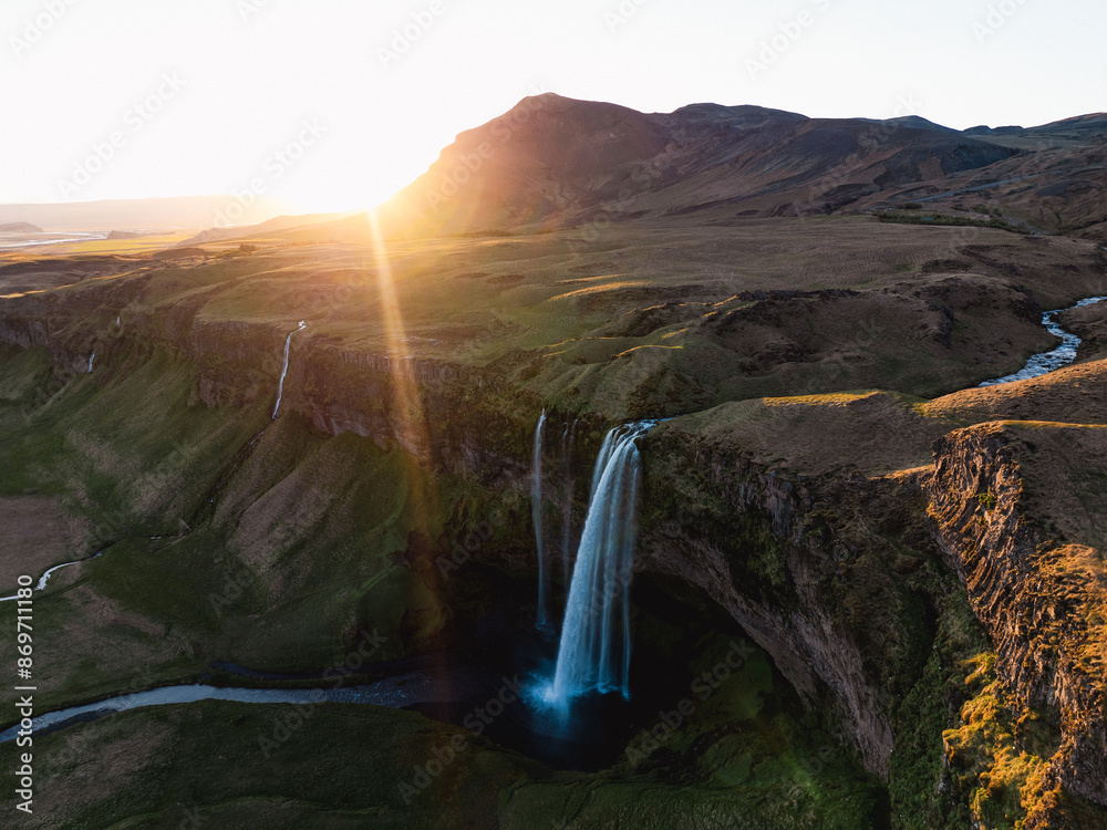 View from above, stunning aerial view of Seljalandsfoss waterfall at sunset. Seljalandsfoss is one of the most impressive waterfalls in the country. Iceland.