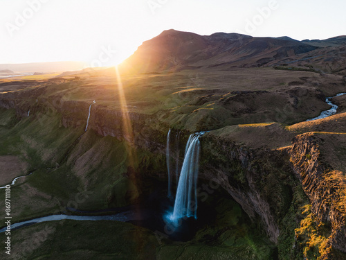 Obraz na płótnie View from above, stunning aerial view of Seljalandsfoss waterfall at sunset. Seljalandsfoss is one of the most impressive waterfalls in the country. Iceland. w salonie