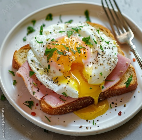 Poached Egg With Ham on Toast, Garnished With Parsley and Pepper