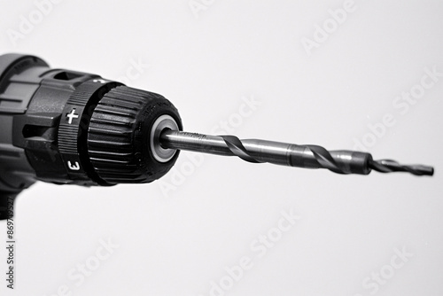 a drill bit against a white background highlighting its sharpness and precision symbolizing craftsmanship and construction