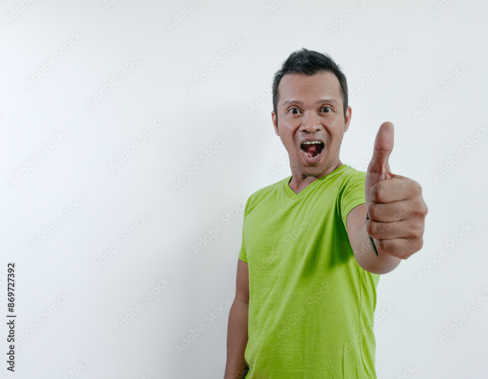 Happy smile asian man showing two thumbs up for good stand isolated on white. Man showing thumbs up. Happy smile asian man showing two thumbs up for good stand isolated on white. Man showing thumbs up.