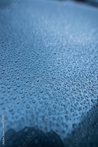 Obraz na płótnie Perfect round water drops on blue car body. Hydrophobic effect after use car ceramic coating w salonie