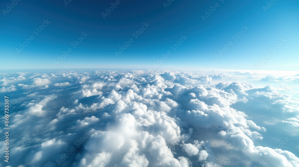 Naklejka premium Bird's-eye view of a blanket of clouds beneath a clear blue sky