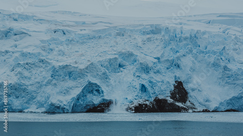 Bild auf Leinwand Antarctica Glacier Melts and Falls Avalanche Climate Change Admiralty Bay Over O