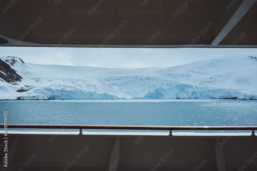 Antarctica Cruise Ship Side Railing POV Wide View of Admiralty Bay Glacier Mountains Covered in Snow Sparkling Ocean. No People.