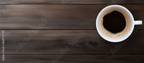 Coffee cup on a blue backdrop with copy space image. photo
