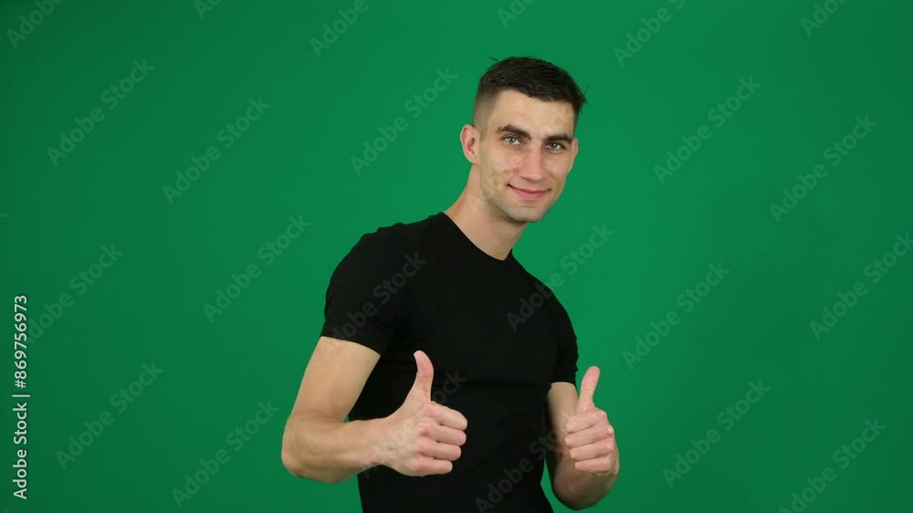 Show thumbs up. emotions of a handsome man guy on a green background chromakey close-up dark hair. young man. Happy Business Man Showing Thumbs Up Gesture While Standing In The Green Screen Studio Show thumbs up. emotions of a handsome man guy on a green background chromakey close-up dark hair. young man. Happy Business Man Showing Thumbs Up Gesture While Standing In The Green Screen Studio