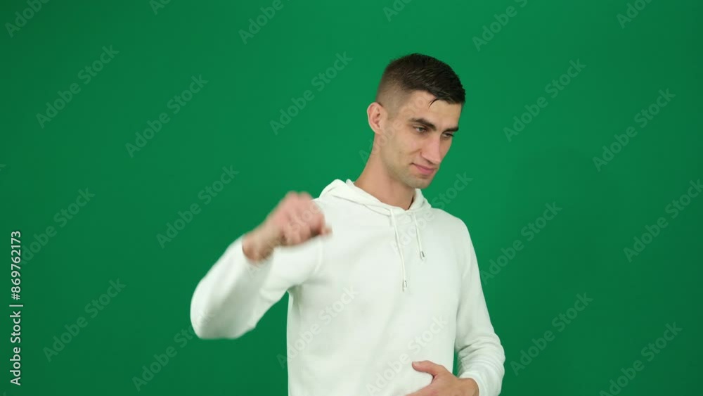 A man, on a white background, close-up, shows strength. Man shows strength A man, on a white background, close-up, shows strength. Man shows strength