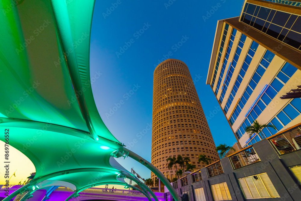 Tampa Riverwalk under a blue sky at sunset