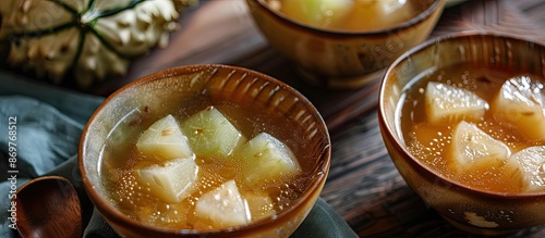 Winter Melon Soup boasts a mild flavor, making it ideal for those who prefer non-spicy dishes. photo