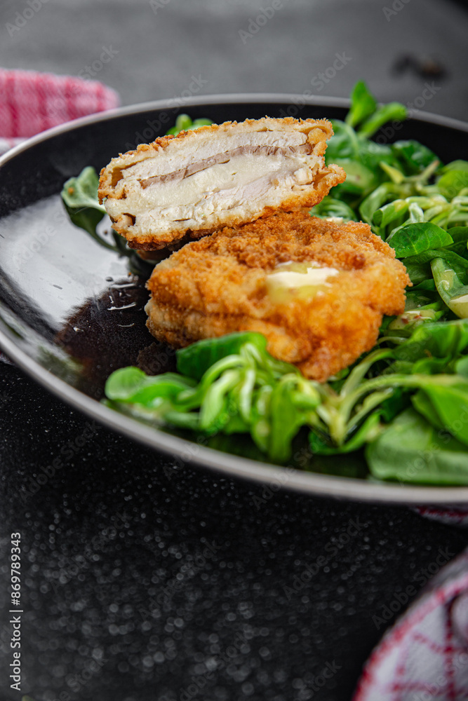 cutlet cordon bleu chicken meat, ham, cheese natural fresh appetizer meal food snack on the table copy space food background rustic top view cutlet cordon bleu chicken meat, ham, cheese natural fresh appetizer meal food snack on the table copy space food background rustic top view