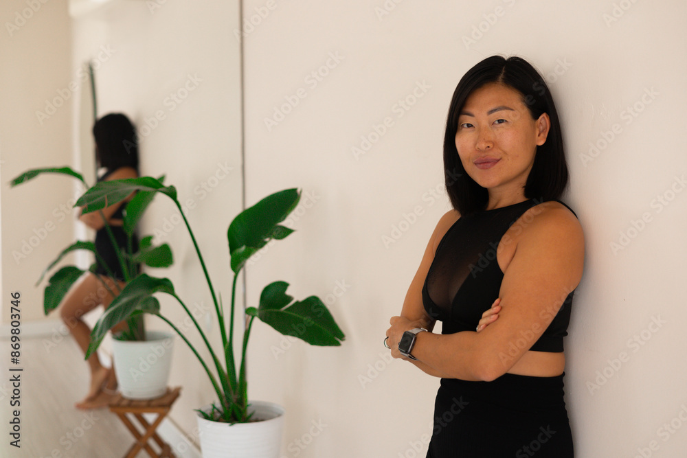 Portait of a sporty asian woman in fitness studio Portait of a sporty asian woman in fitness studio
