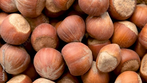 Close-up view of shelled hazelnuts rotates