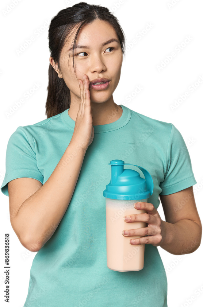 Chinese athlete with protein shake is saying a secret hot braking news and looking aside Chinese athlete with protein shake is saying a secret hot braking news and looking aside