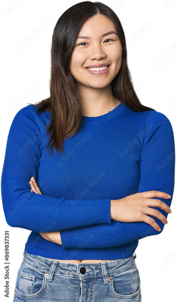 Young Chinese woman who feels confident, crossing arms with determination. Young Chinese woman who feels confident, crossing arms with determination.