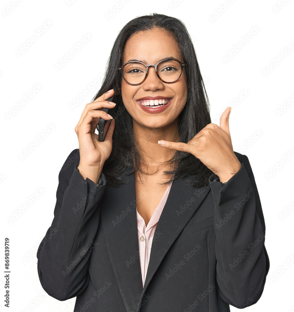 Latina in suit with phone in studio showing a mobile phone call gesture with fingers. Latina in suit with phone in studio showing a mobile phone call gesture with fingers.